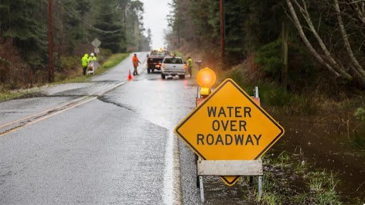 Water over roadway sign